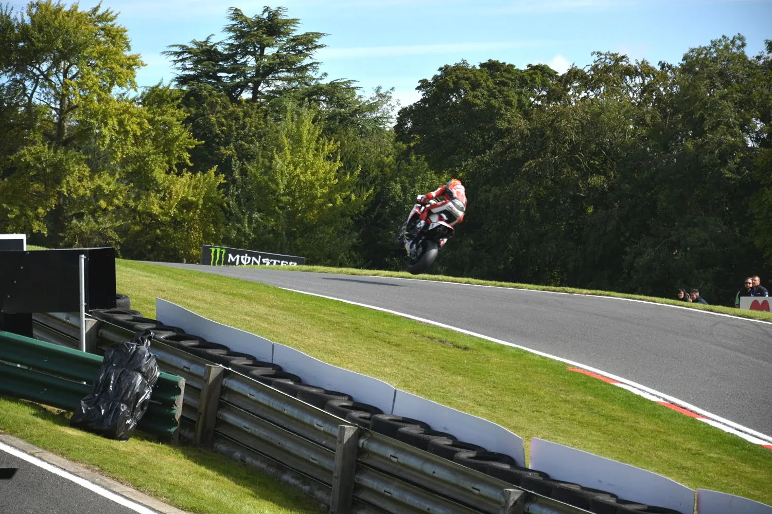 A British Superbike rider airborne over the Mountain at Cadwell Park in 2014.